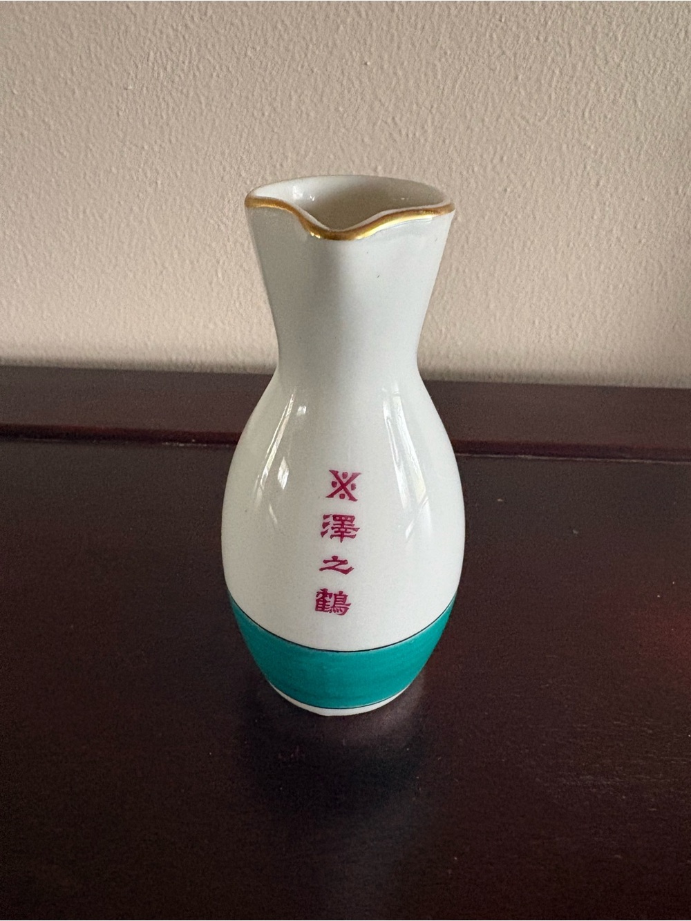 Japanese Sake bottle with gold trim. Sawanotsuru brewery